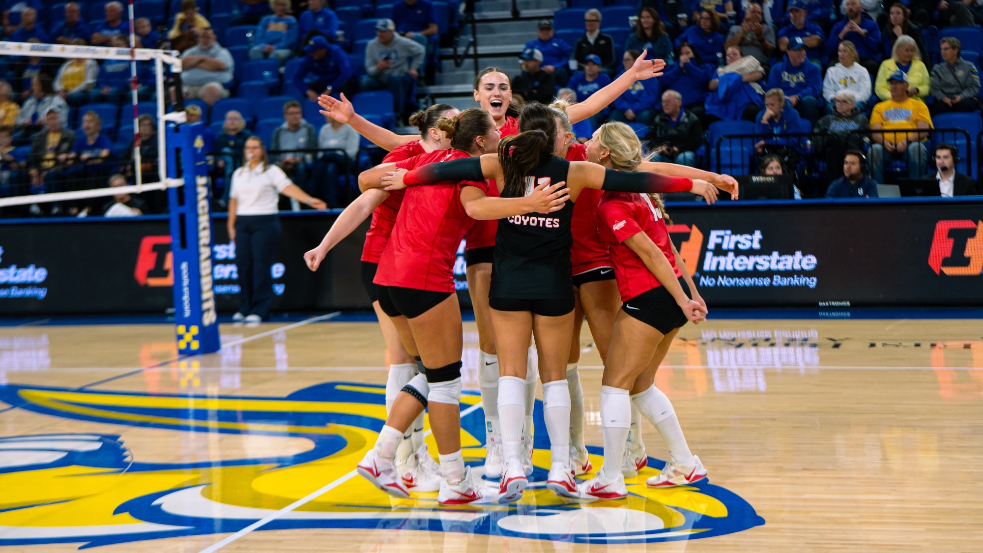 South Dakota volleyball celebrating the match winning point at South Dakota State 2026