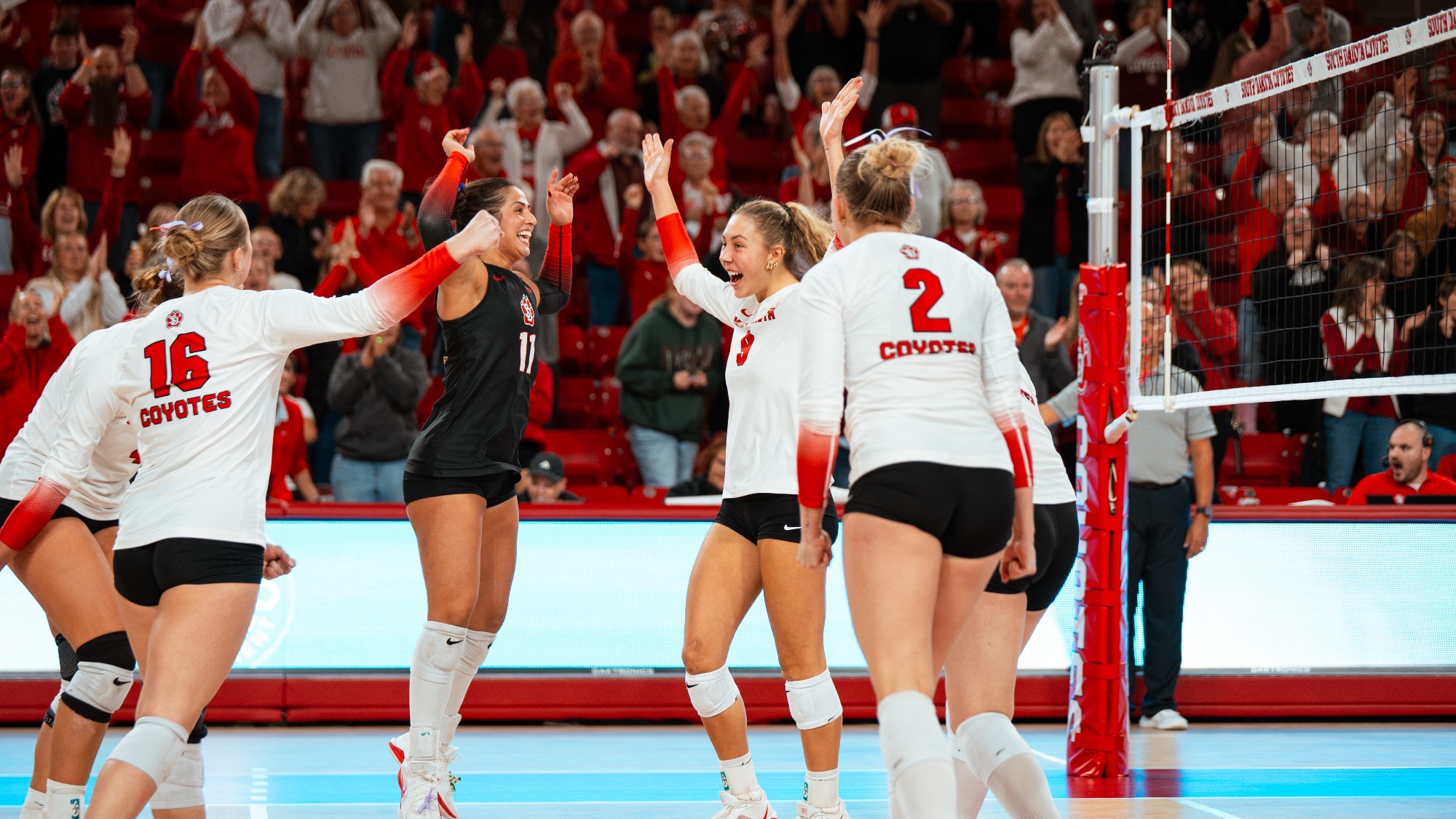 Team celebrating a point against Omaha 2026