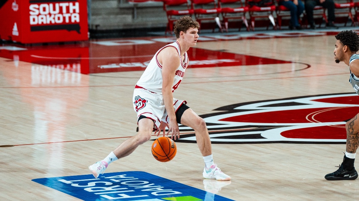 Vince Buzelis dribbling the ball against Dakota State
