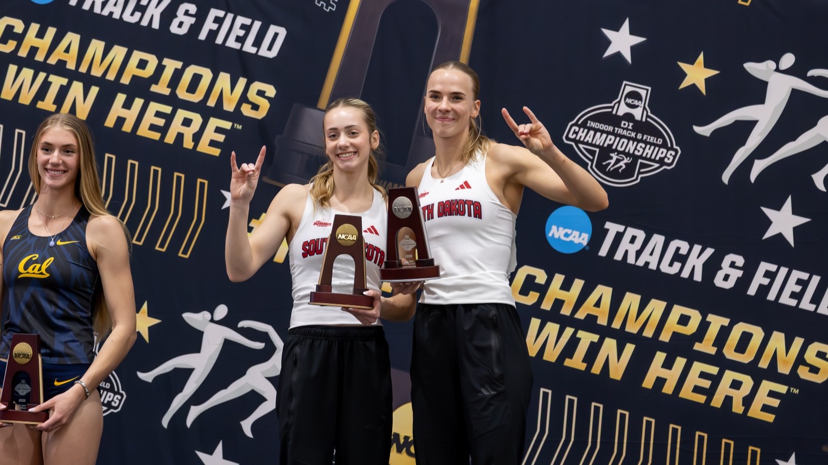 Anna Willis and Marleen Mülla pose for a photo together with their all-American trophies