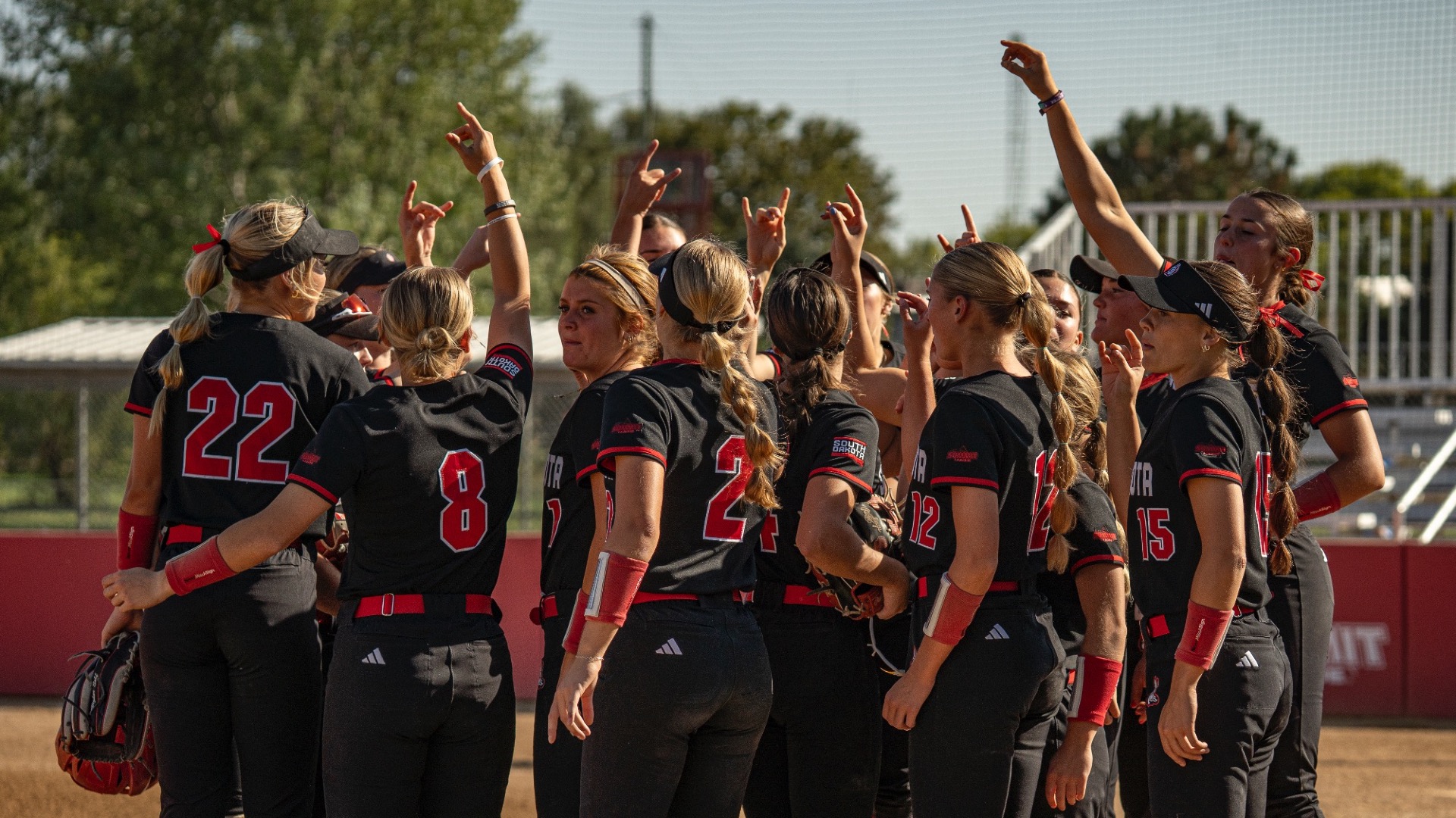 team huddle at Nygaard field