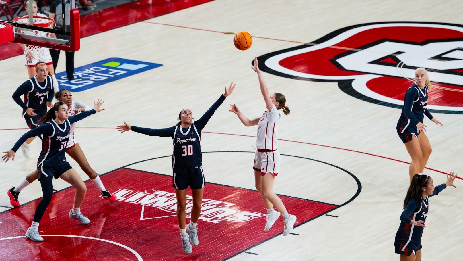 Molly joyce puts up a shot over a Pepperdine defender inside the SCSC