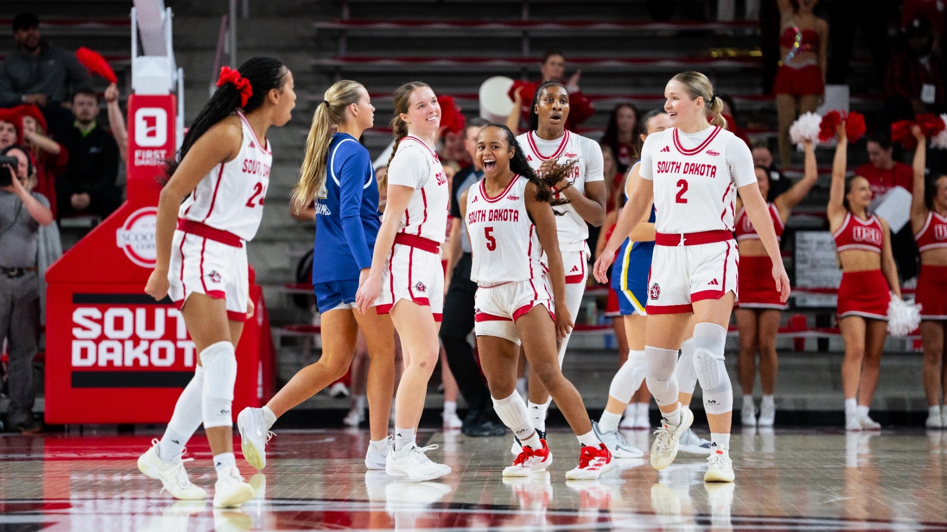Coyotes celebrate on the SCSC Floor against SDSU 