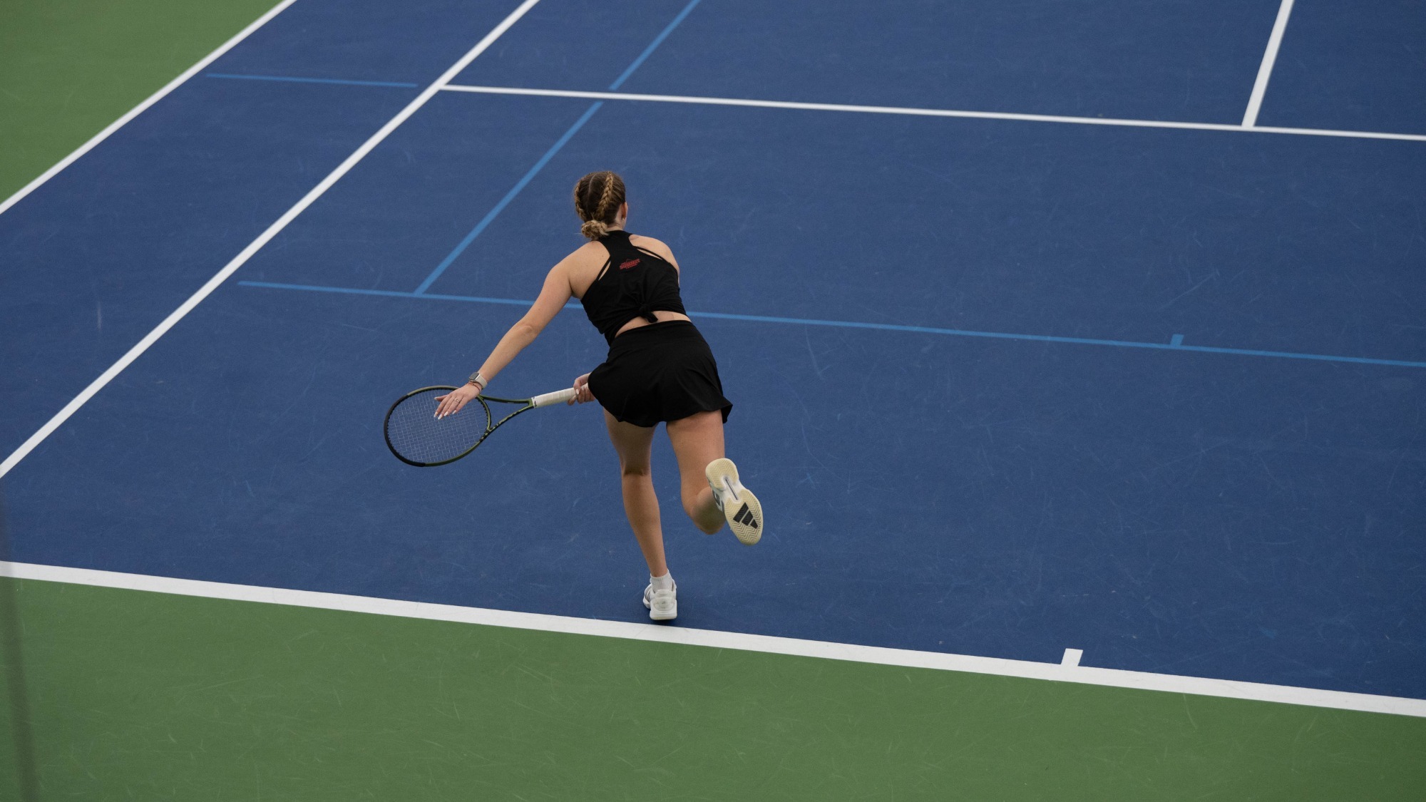 Anna serves to kick off first singles match of the day.