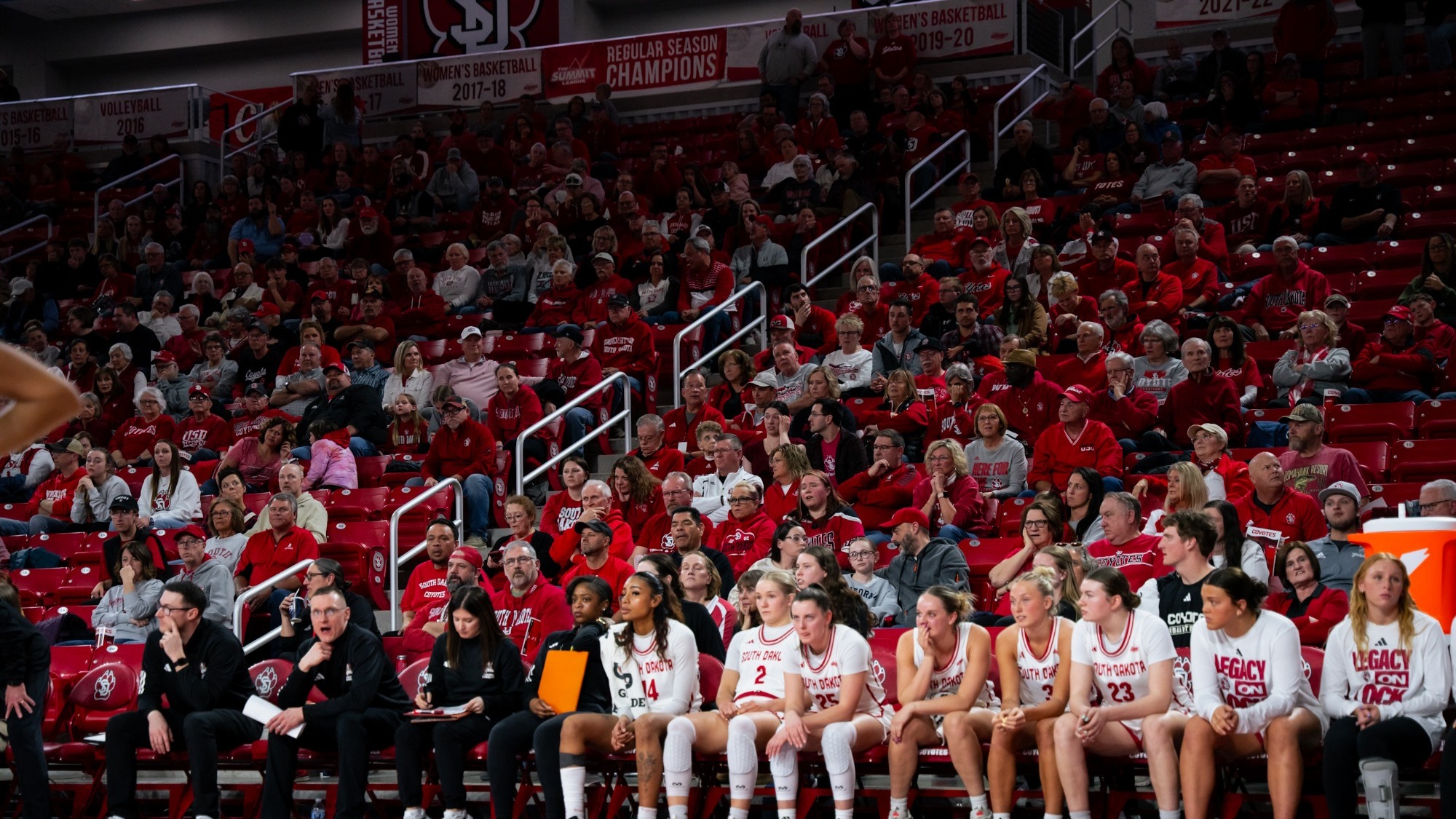 Coyote fans and bench look on during WNIT Fab Four game against Illinois State