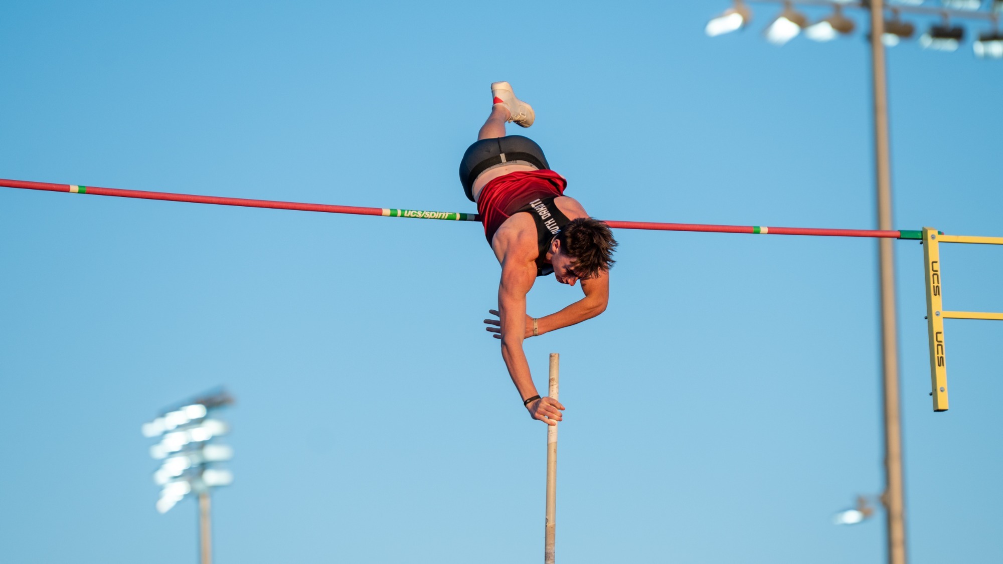 Caelan Harland competes in the pole vault at the Lillibridge Track Complex in Vermillion