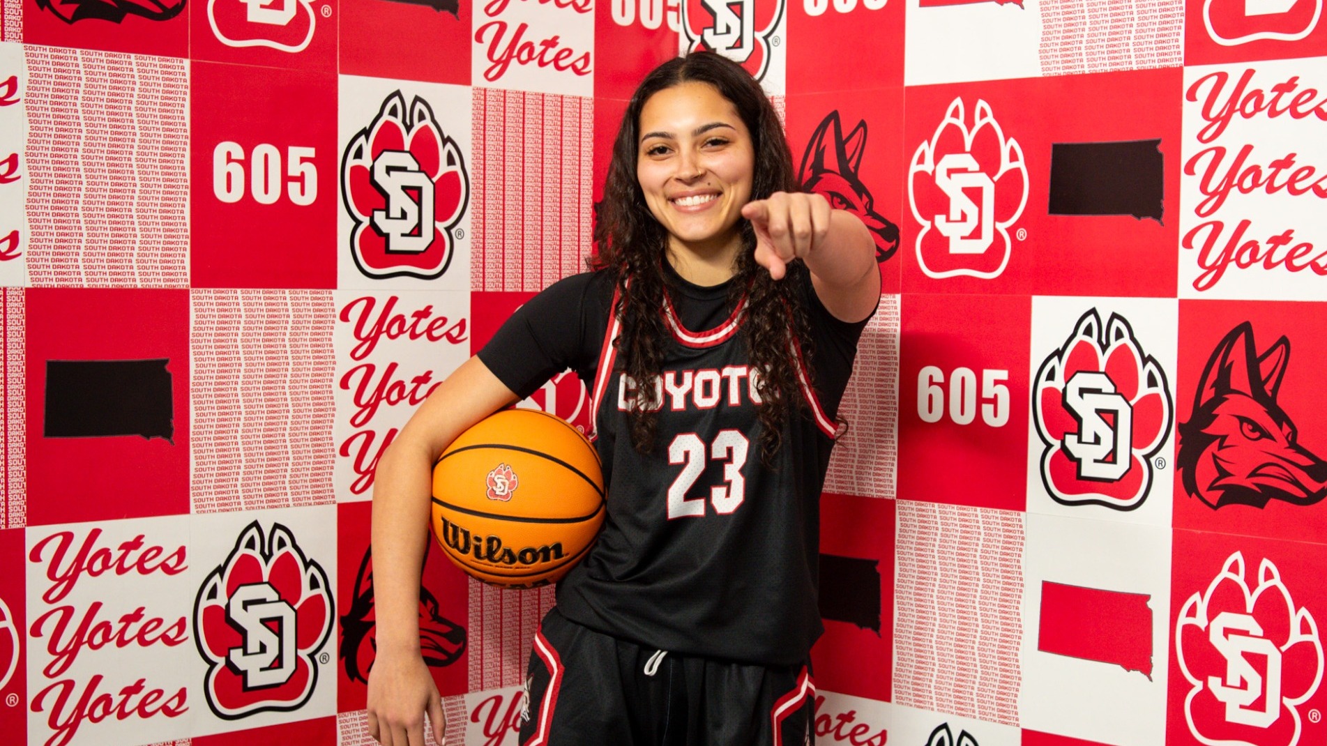 Bri Robinson poses for photos in a South Dakota jersey