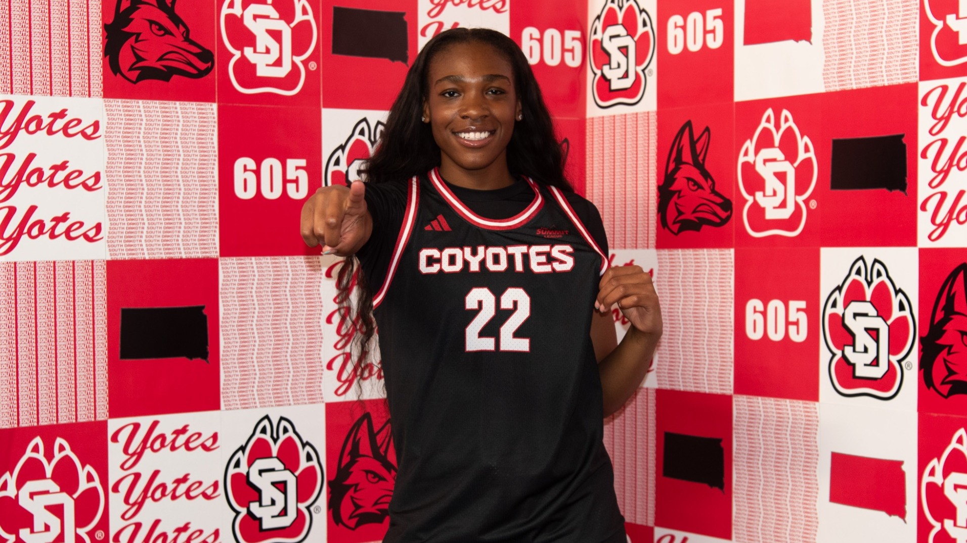 Latazia Williamson poses for a photo in a South Dakota jersey