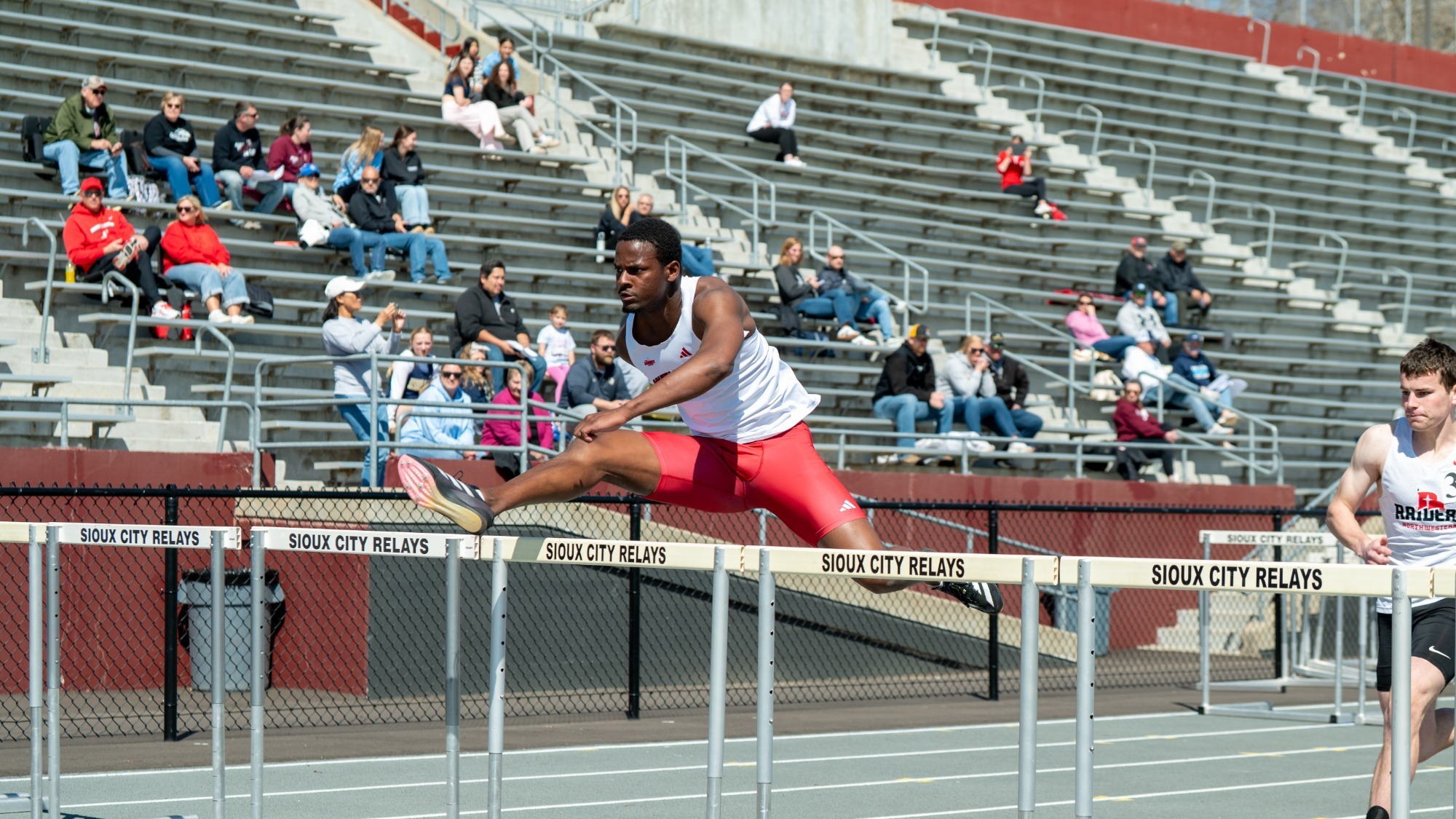 Xander Provance competes in the 110-meter hurdles at the Sioux City Relays