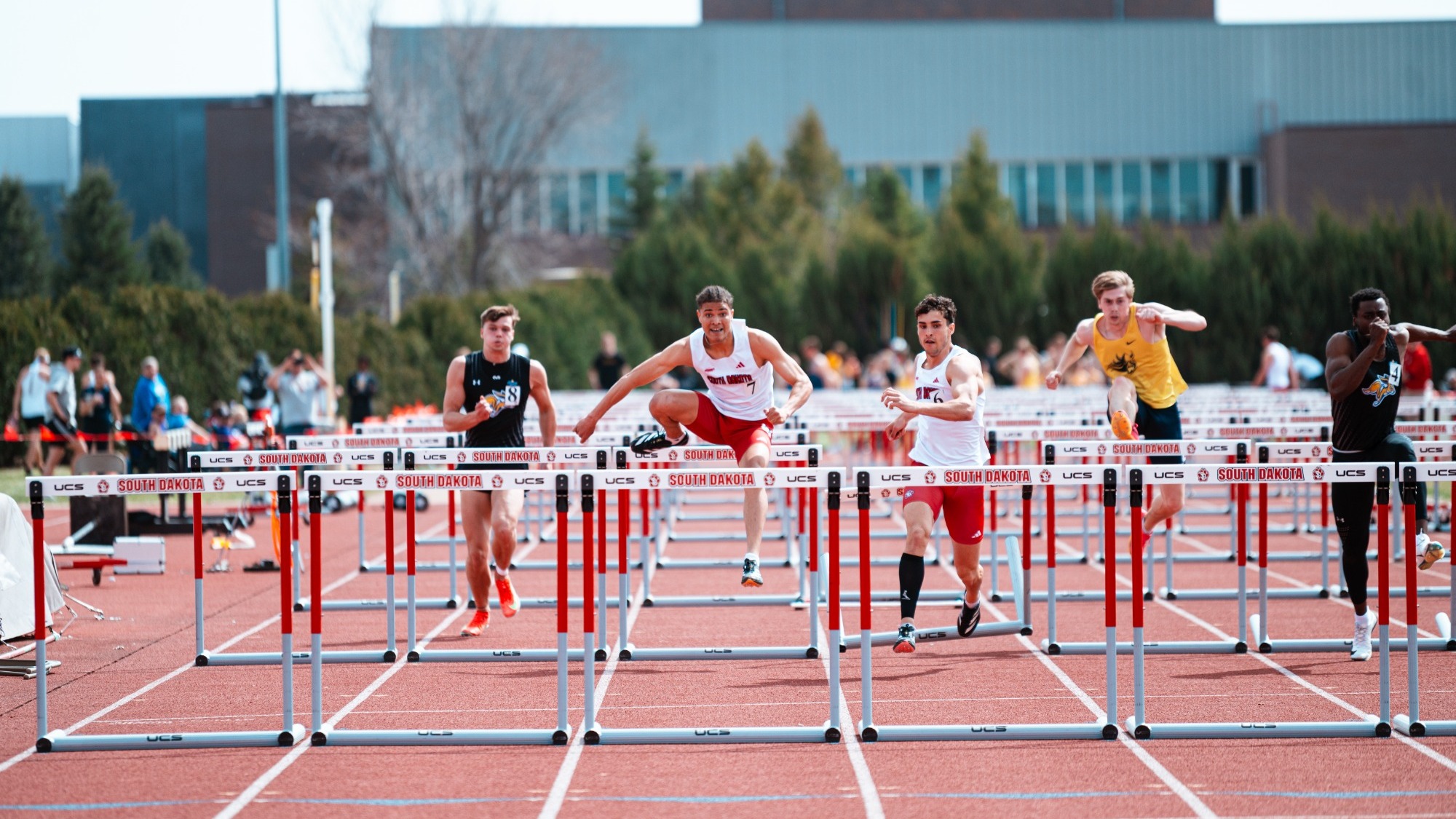 Mikael Grace and Jaden Damiano compete in the 110-meter hurdles at the Lillibridge Track Complex