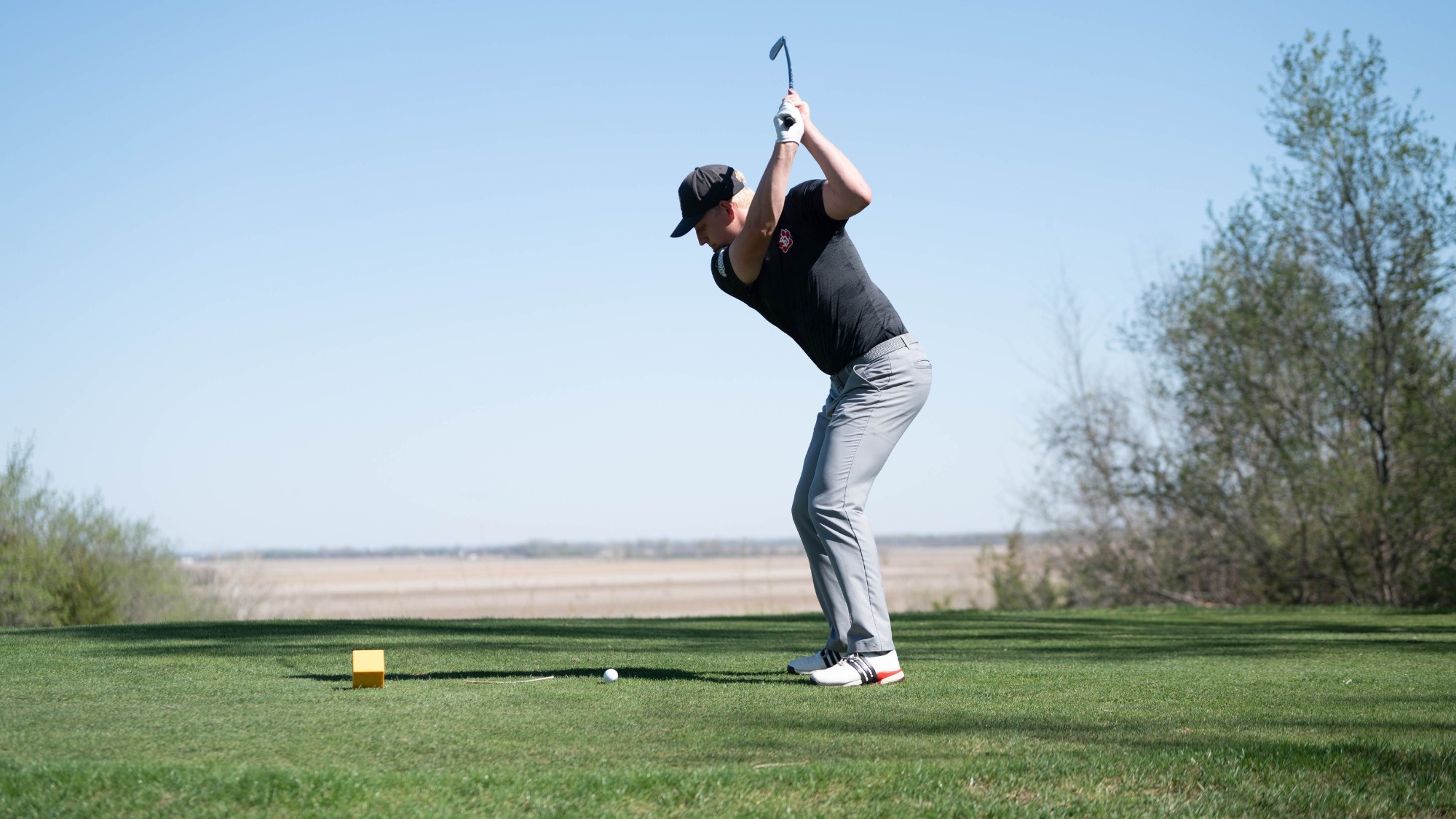 Joe tees off on hole 13 at the Bluffs.