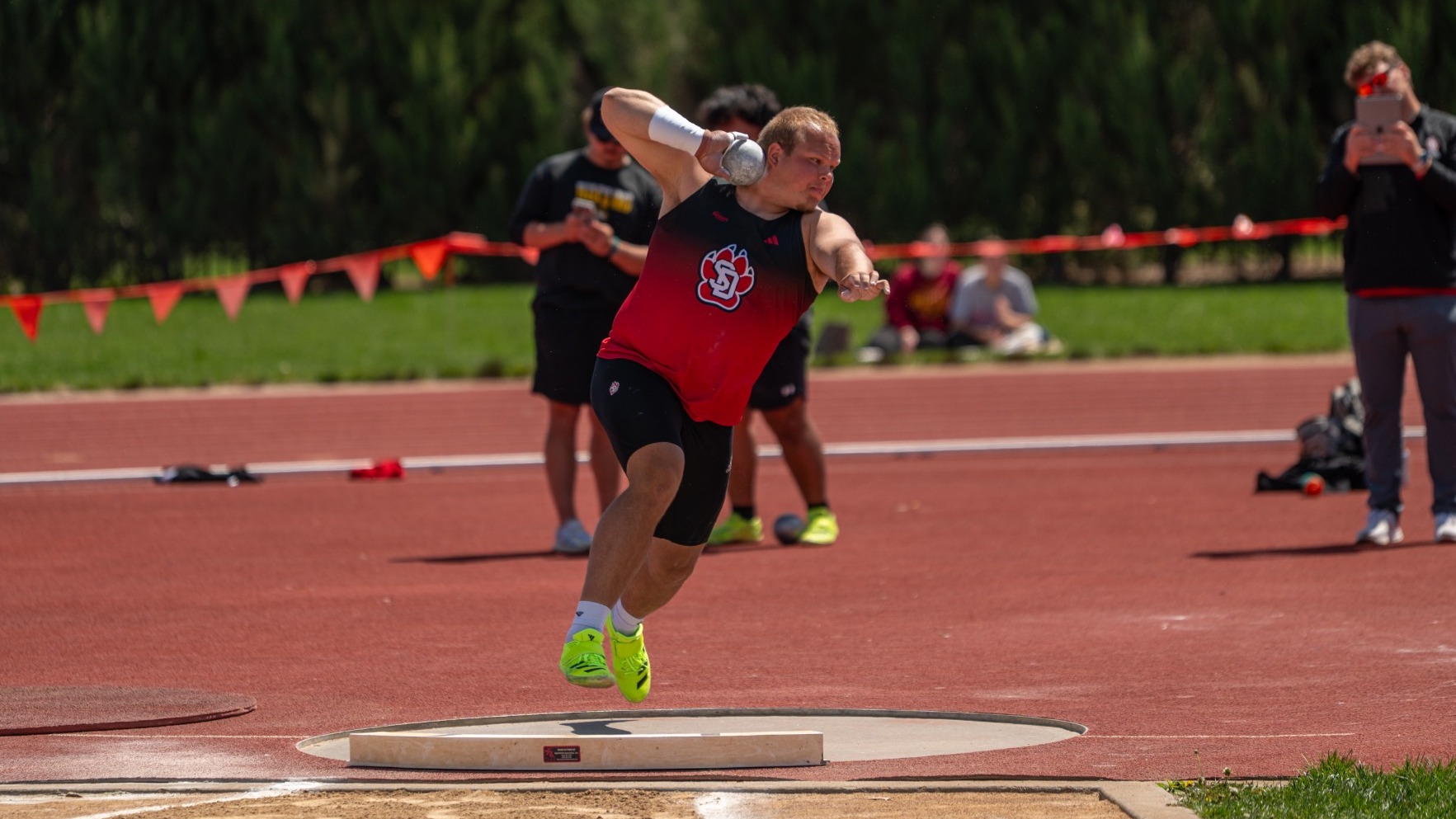Brandon Vander Sluis competes in the shot put at a home meet earlier this season