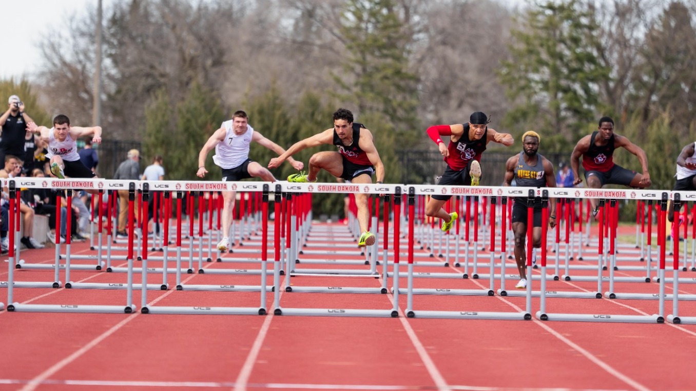 Jaden Damiano competes in the 110-meter hurdles at a home meet earlier this season