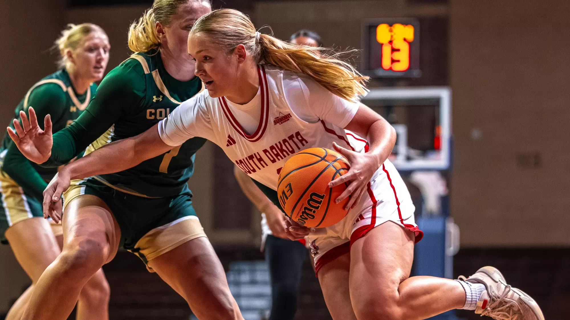 Jenna Hopp drives with the ball against Colorado State in an exhibition at the Sanford Pentagon