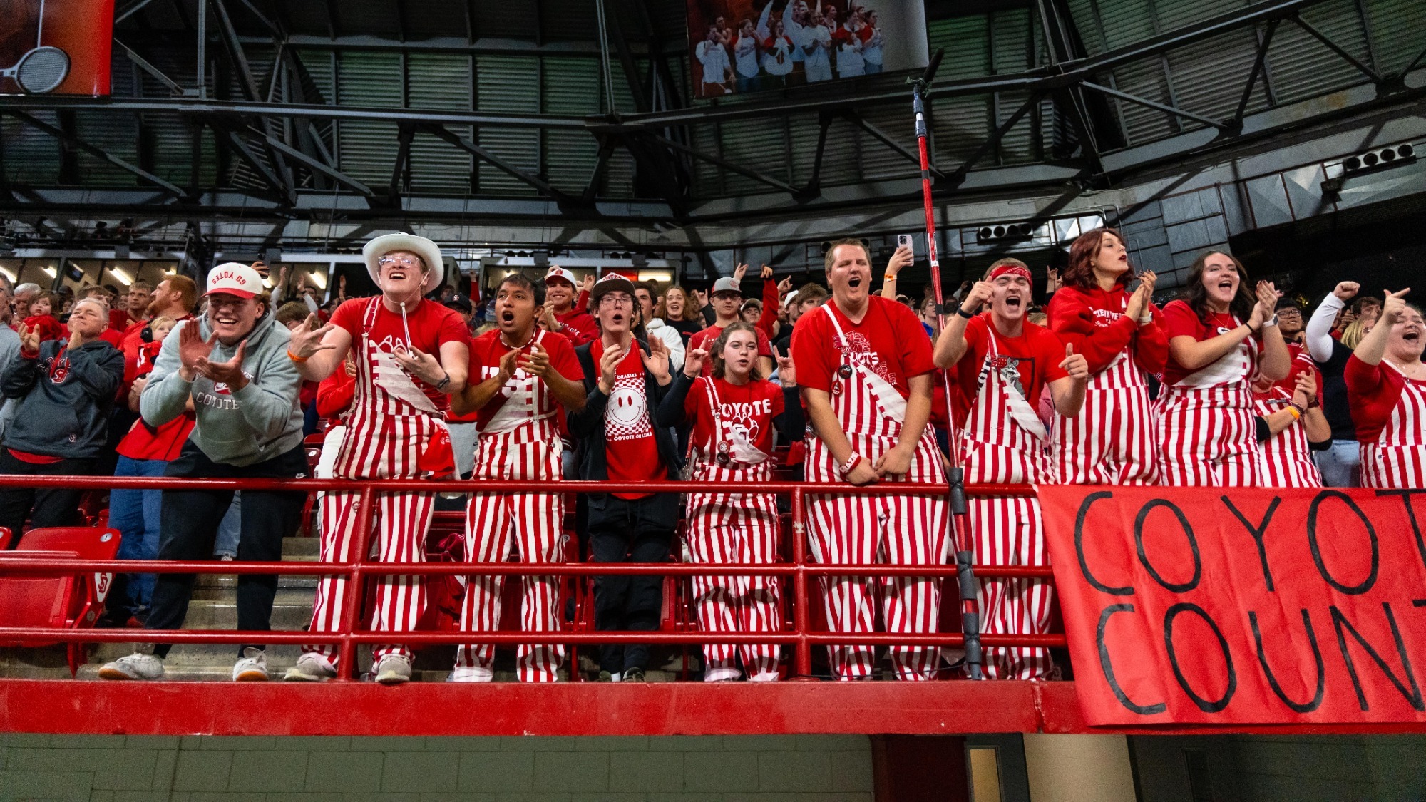 South Dakota fans cheer on the Coyote football team inside the DakotaDome
