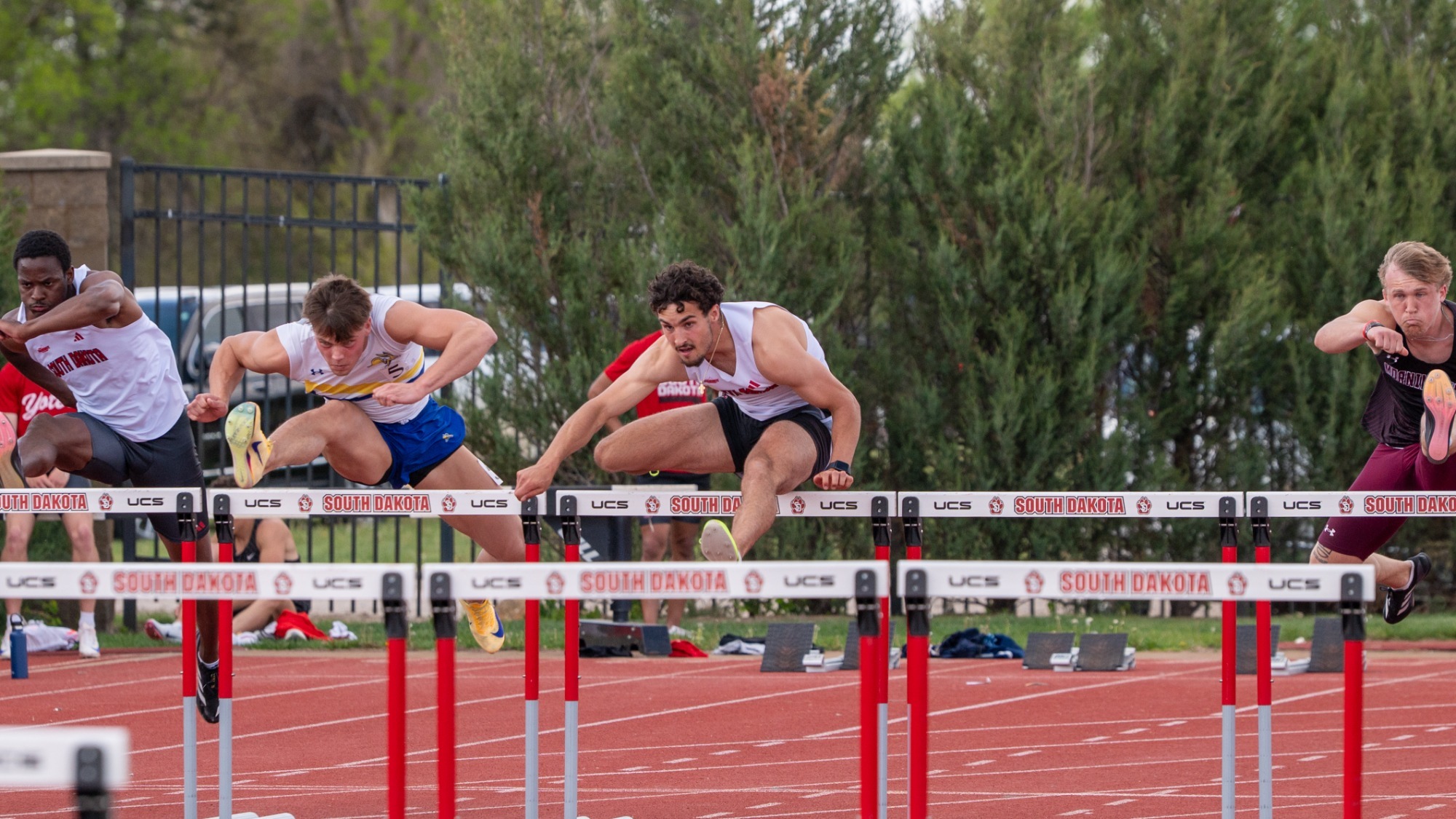 Jaden Damiano competes in the 110-meter hurdles at the USD Twilight