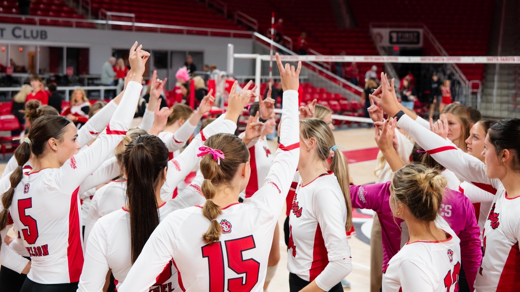 Volleyball team huddle after a match against Denver 2025