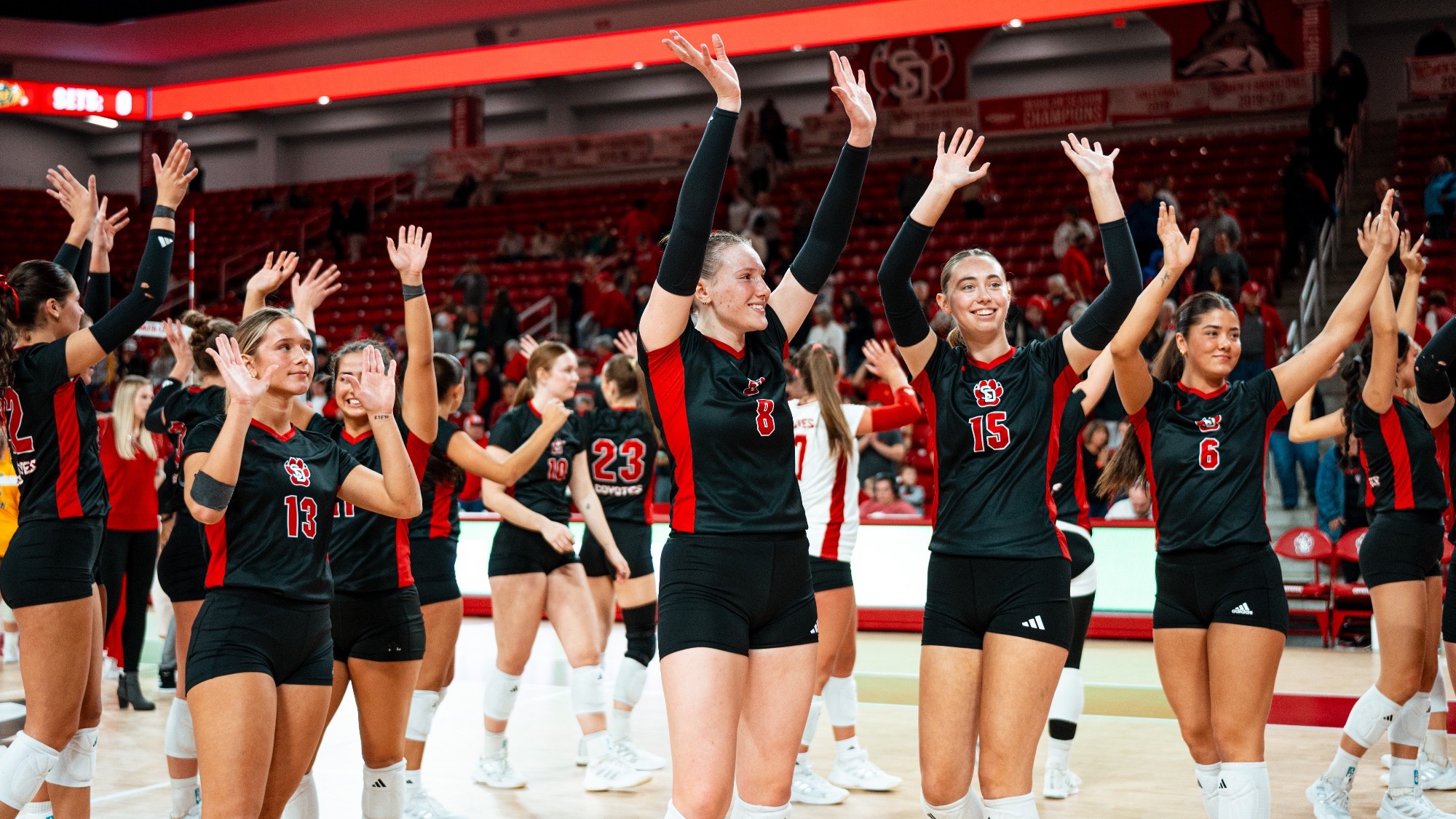 Volleyball team waving to fans after a home match against NDSU 2025
