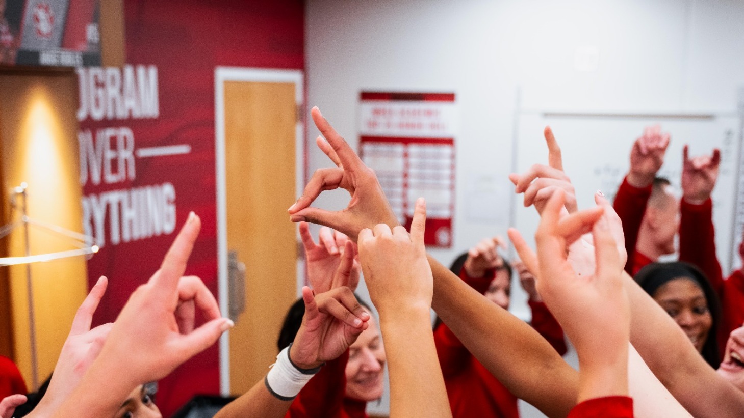Team huddle in locker room after a win