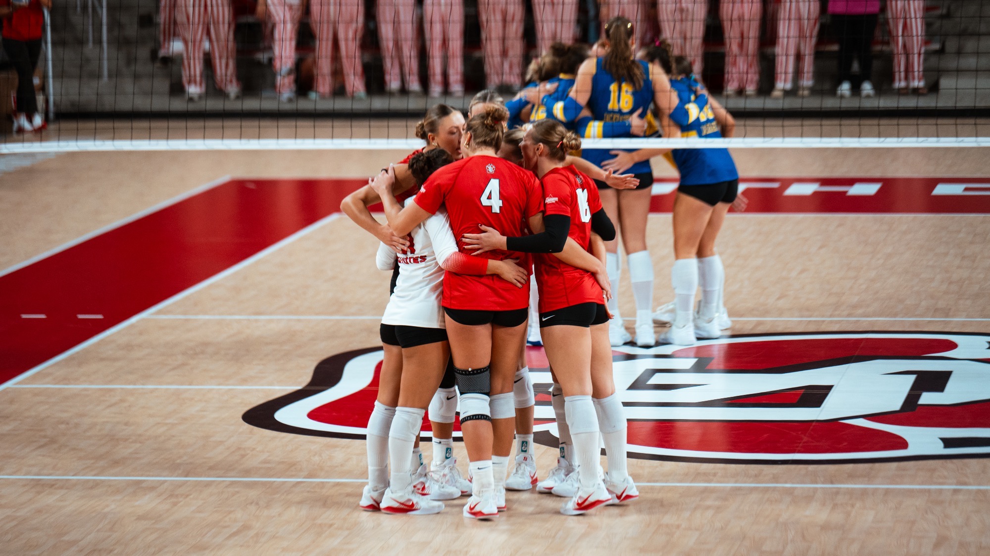 Team huddle after a point against SDSU 2026