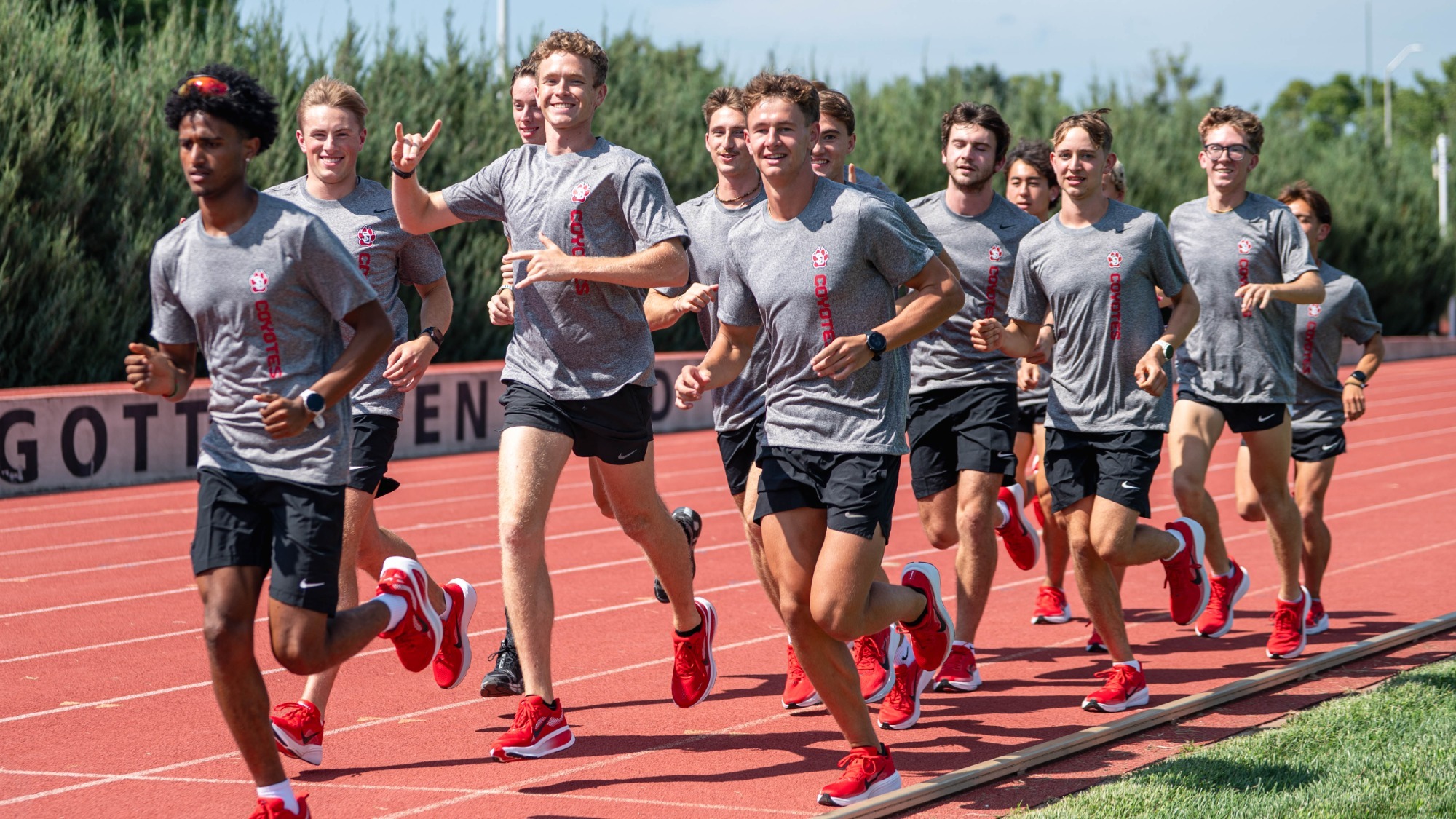 The men's cross country team warms up at the Lillibridge Track