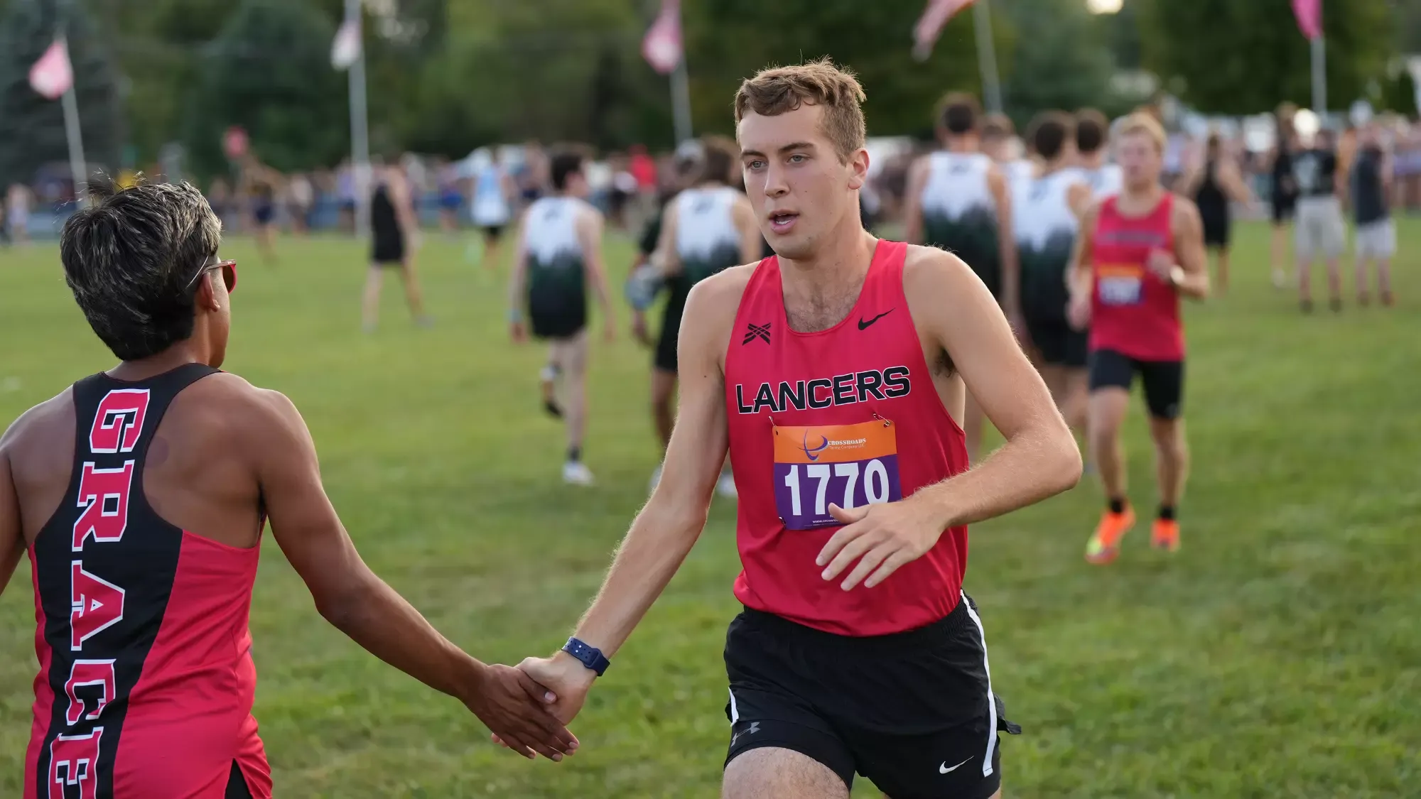 Cole Johnston red XC high five 2024