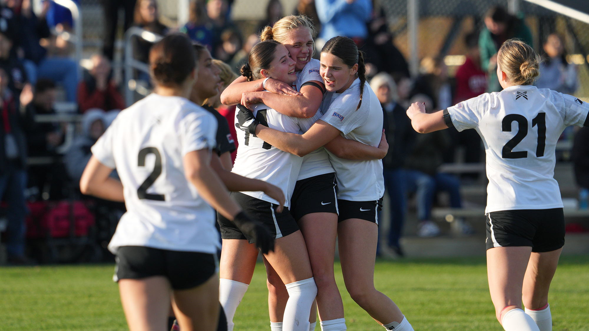 WSOC trio girls hug after goal 2025 naia 