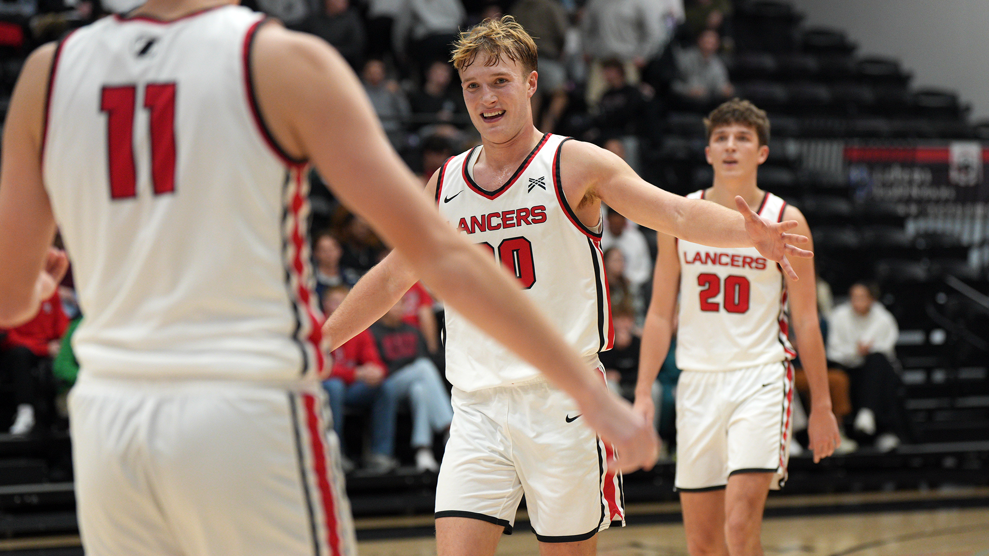 Gage Sefton smiles high five MBB 2025