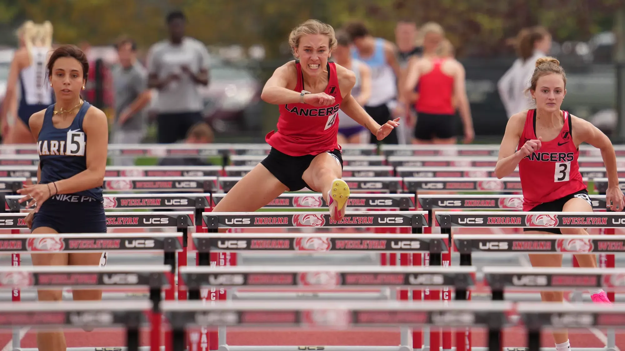 Emma Conrad hurdles clear red TRACK 2025