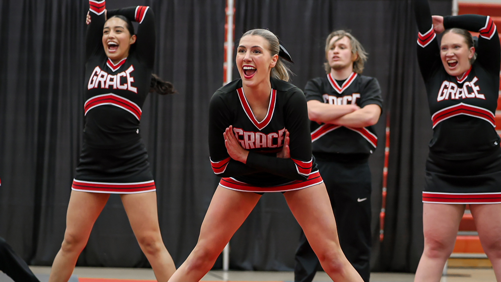 Cheer team smiles pose 2026