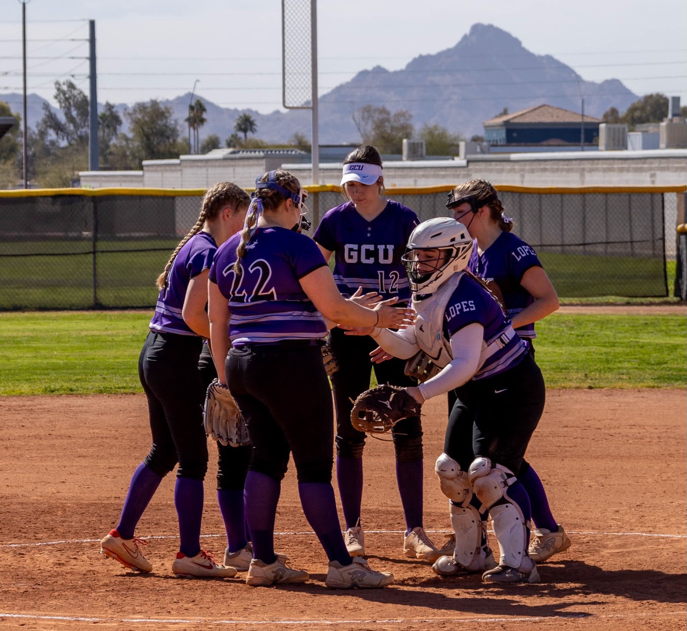 GCU Club Softball huddle vs. NAU 2-15-25