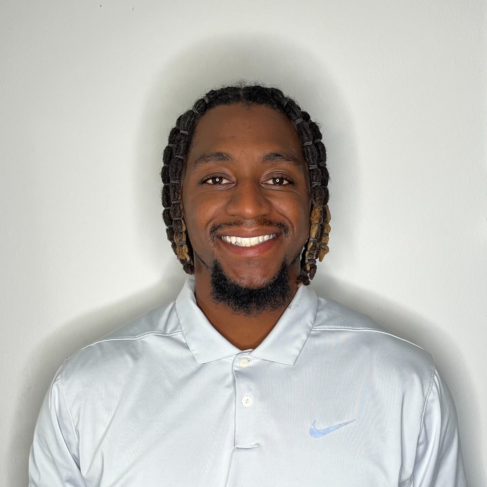 Coach Jon Tate headshot white shirt