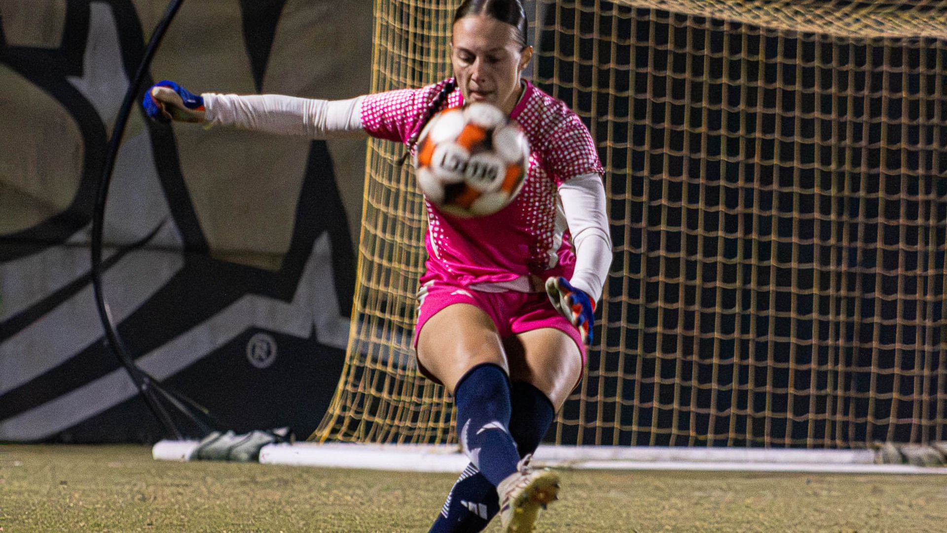 Hannah Garrett punts ball vs Flagler