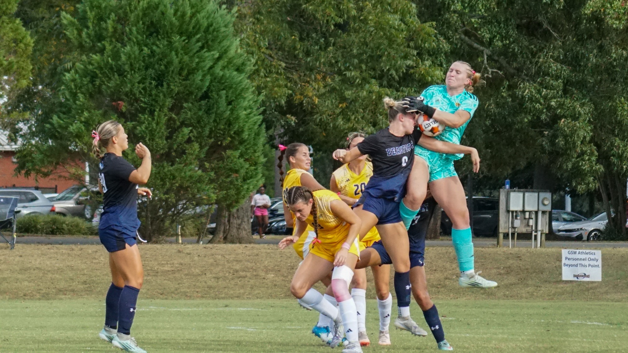 Alana Beddow goes up for save in group of several players vs USCB