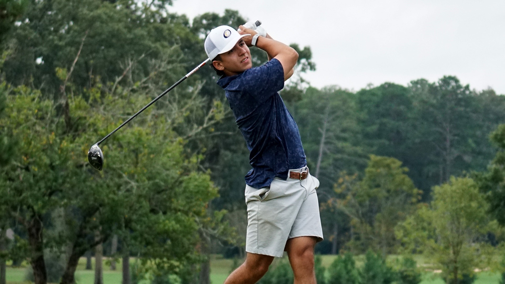 Juan Velasquez follows through on drive at Hurricane Invitational