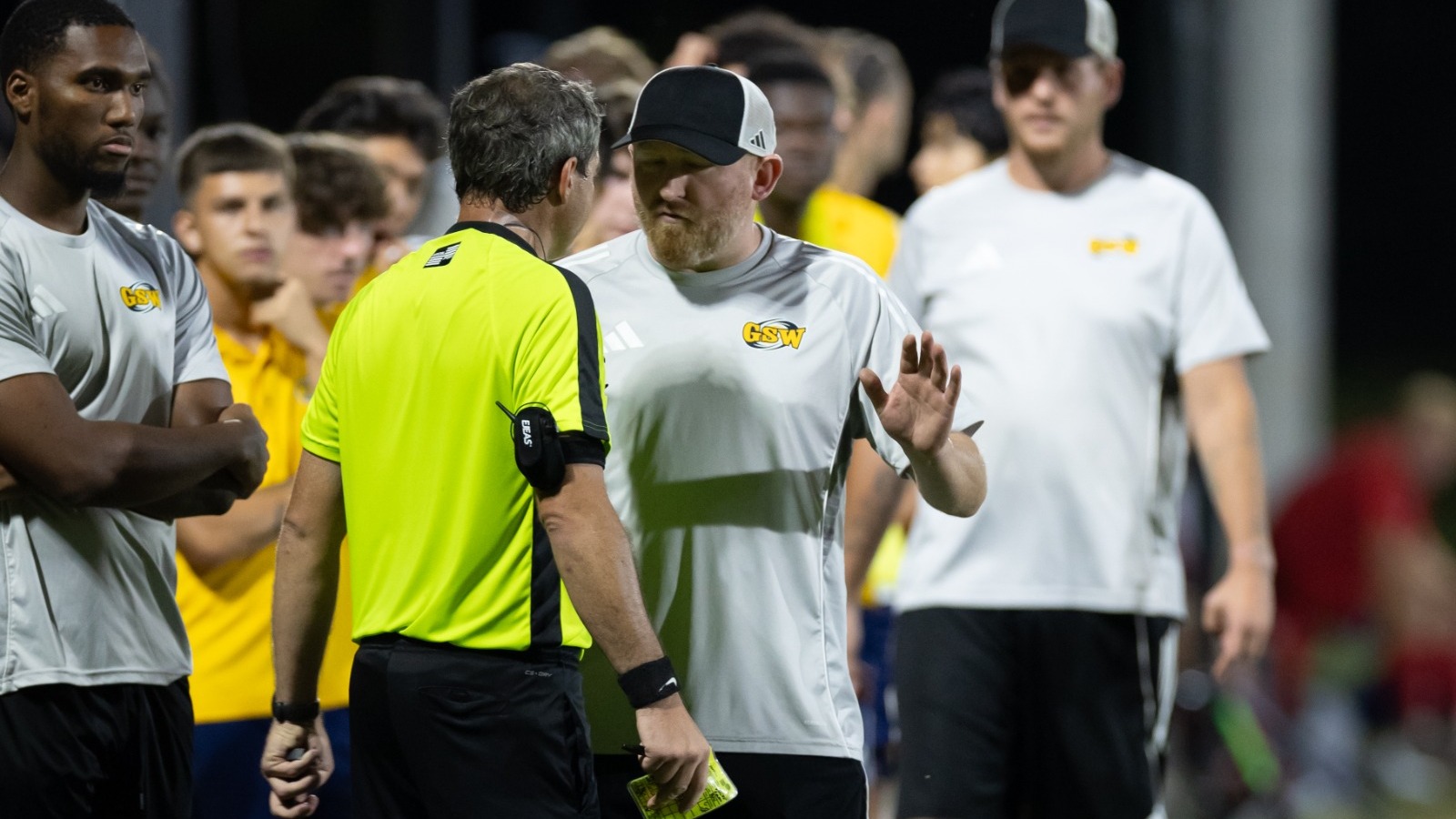 Barber talking to official 25