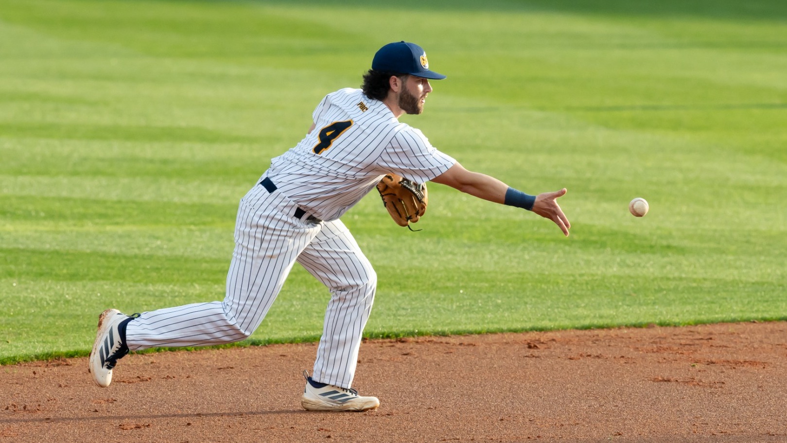 Jacob Reeves tossing ball to second base