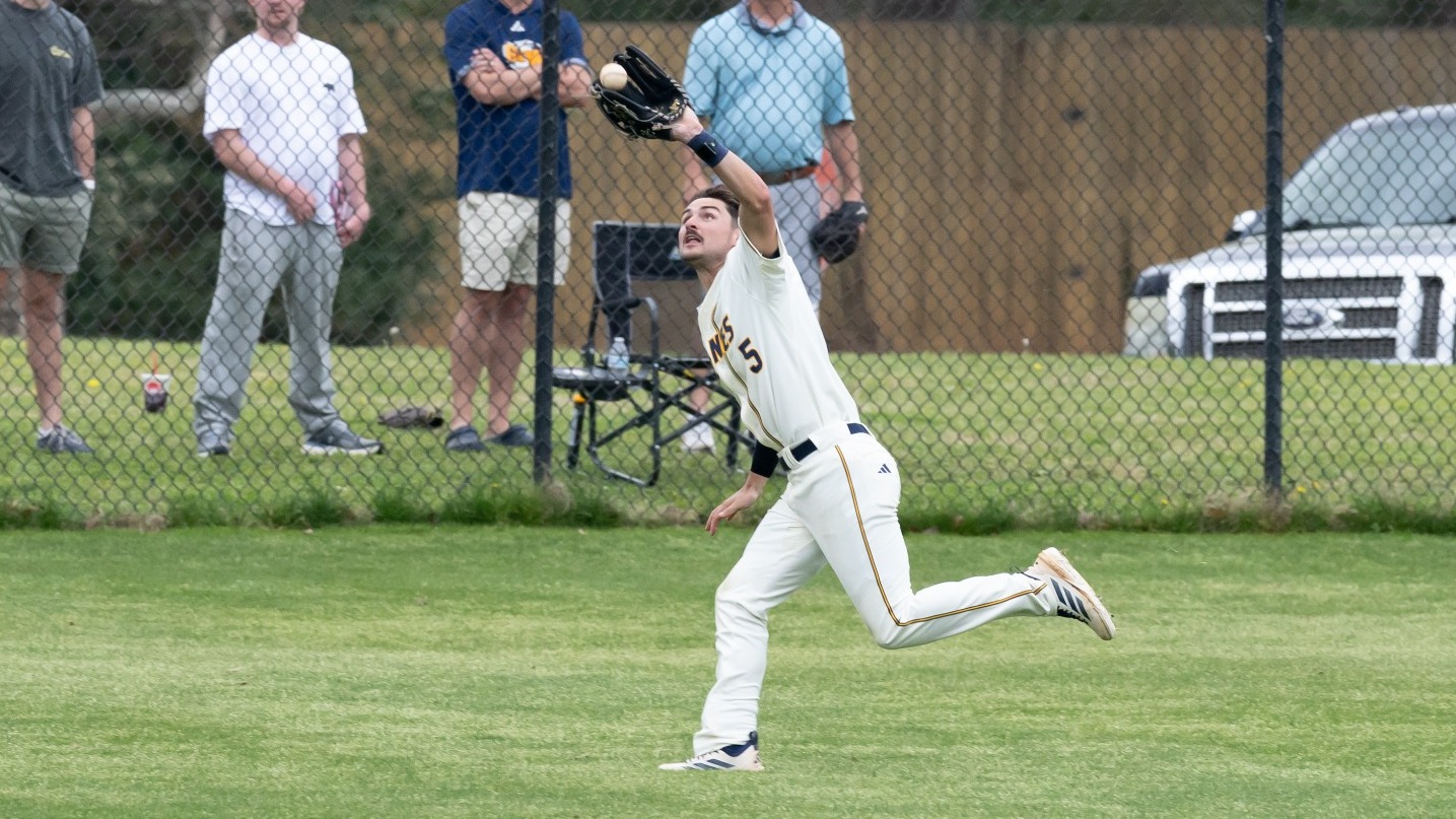 Murphy running catch in cream uniform
