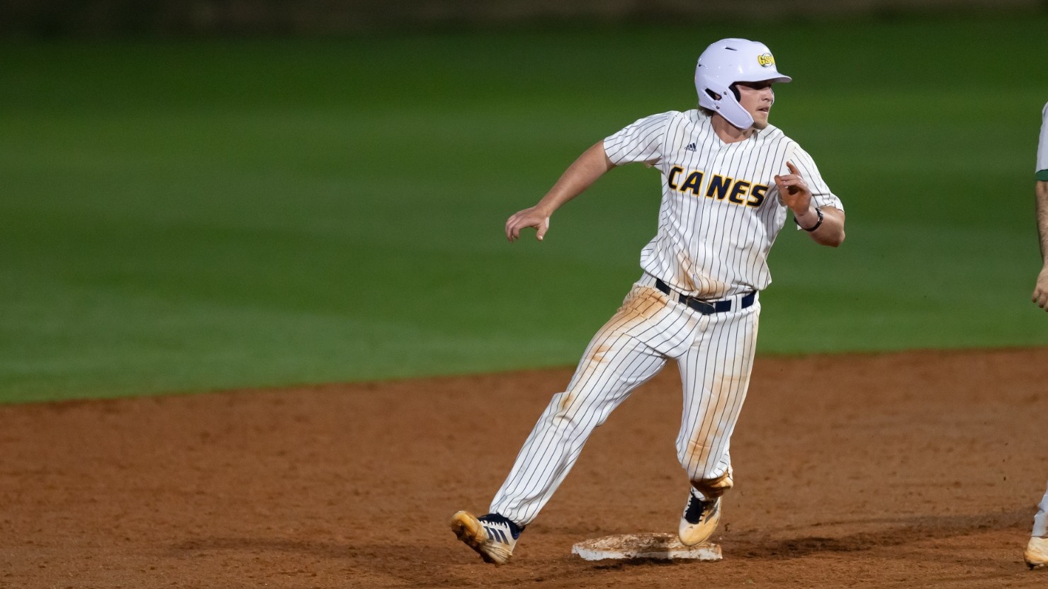 Harman rounding second base against Georgia College