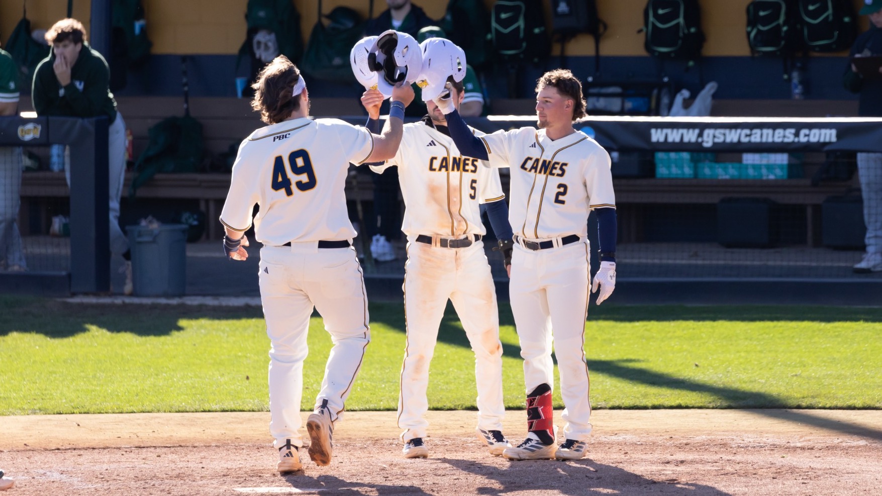 Three GSW Players Tapping Helmets Following Home Run vs Georgia College