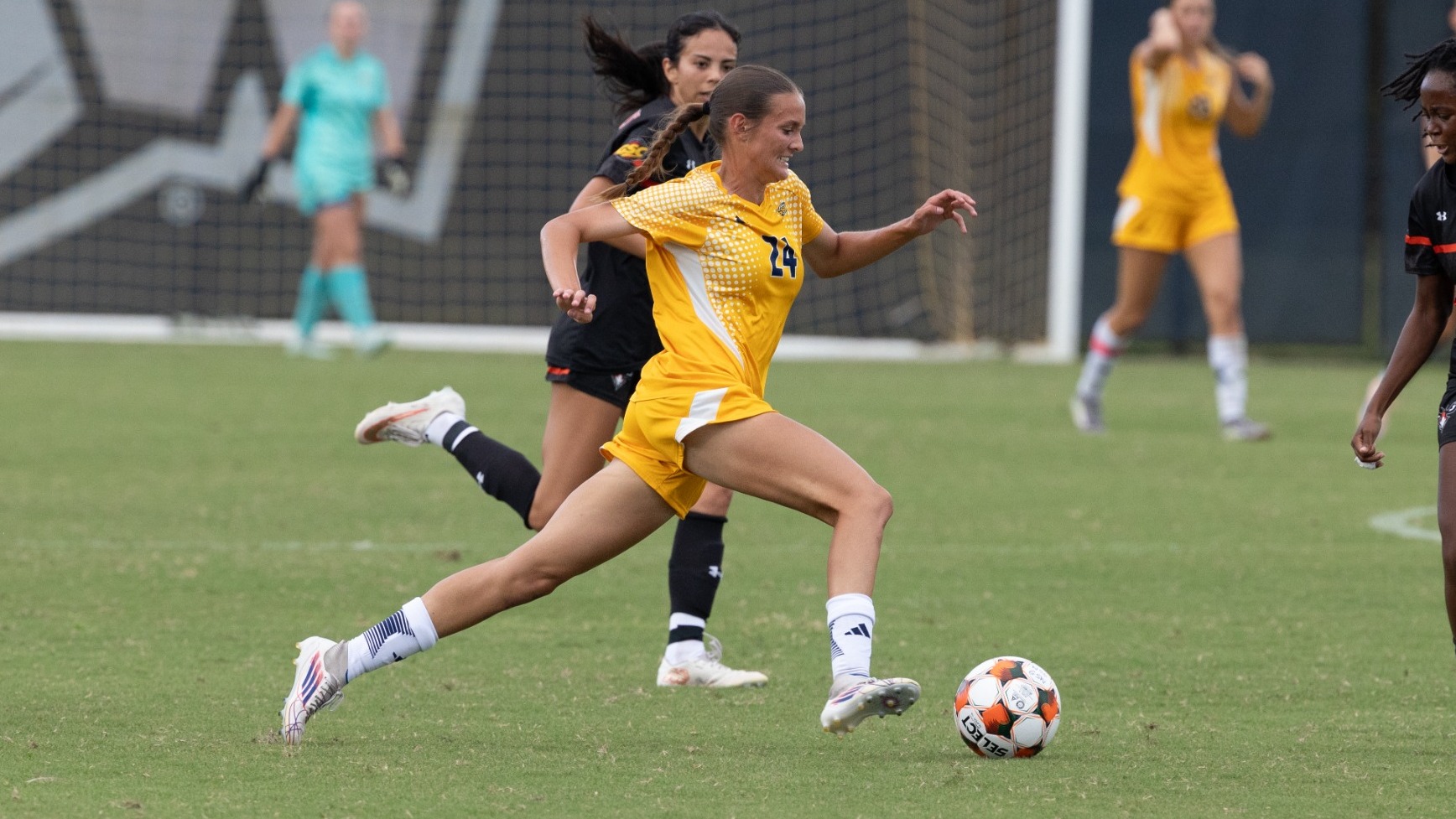 St John drives with ball vs AUM