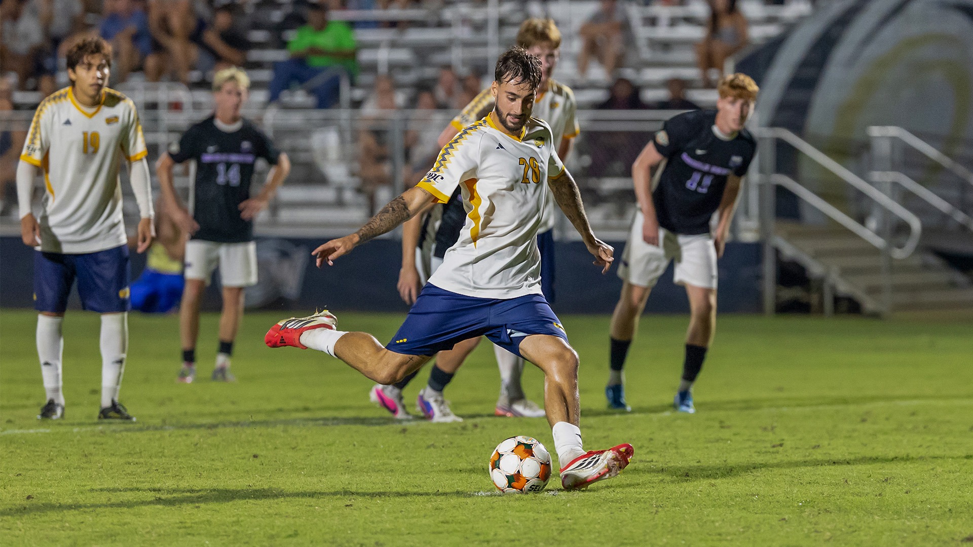 Hoang goes for penalty kick against Middle Georgia