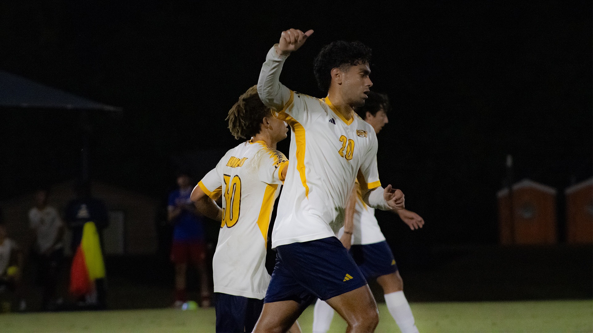 Juan Franco with hand in air after goal vs Clayton State