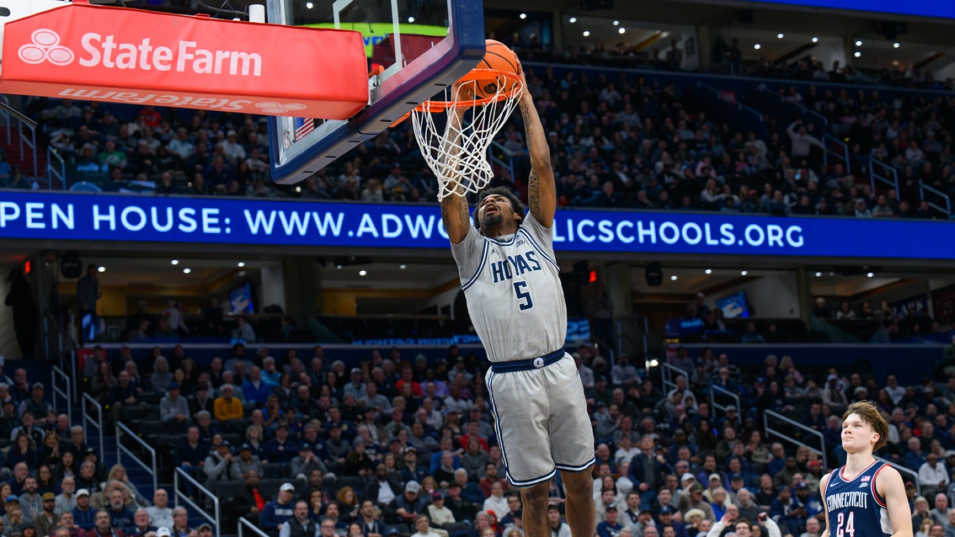 Men's Basketball's KJ Lewis dunks against UConn