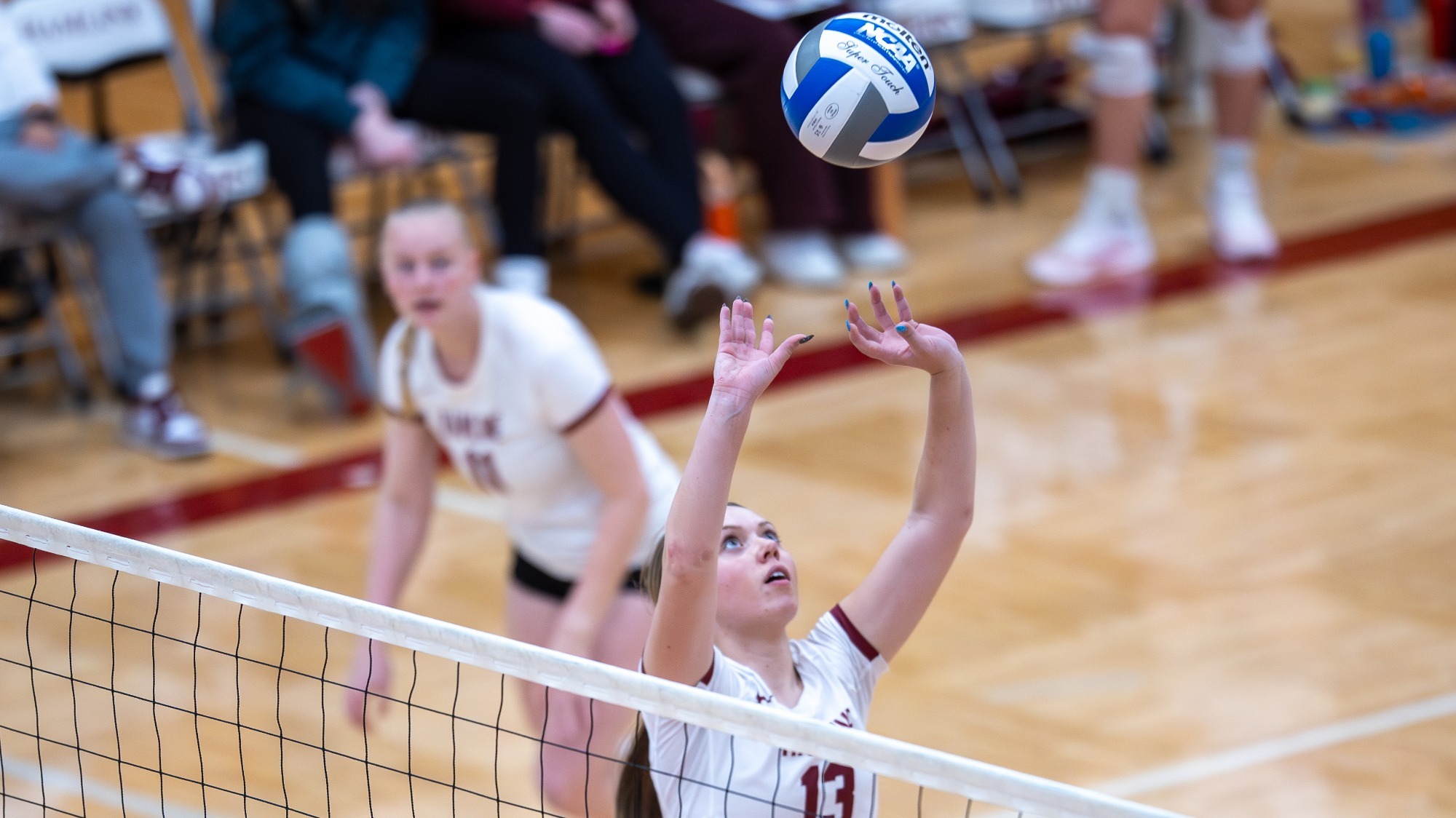 Kaitlyn Kotek setting the ball; Hamline volleyball vs Concordia Moorhead