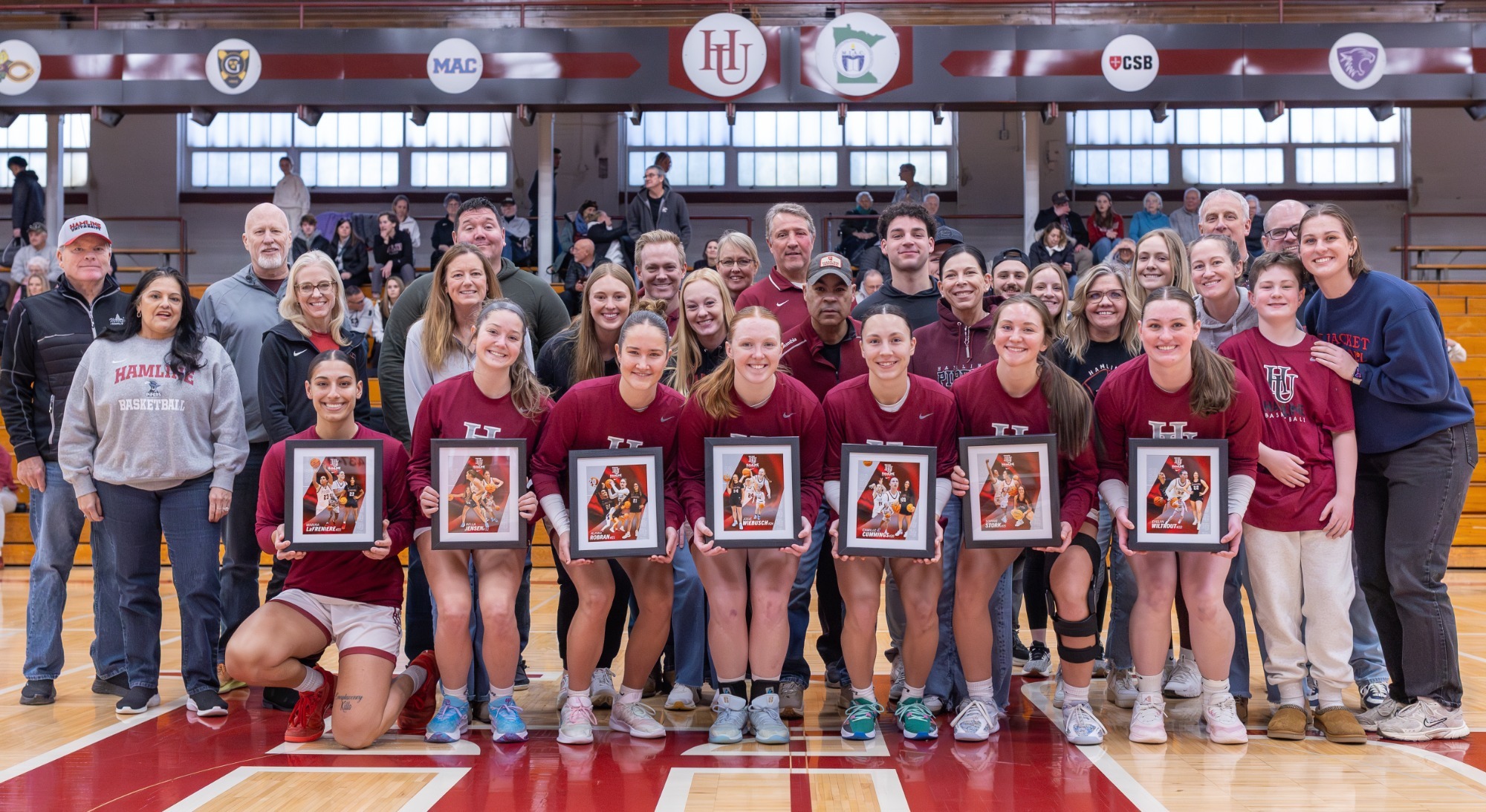 Hamline women's basketball 7 seniors and their families before game against St. Kate's