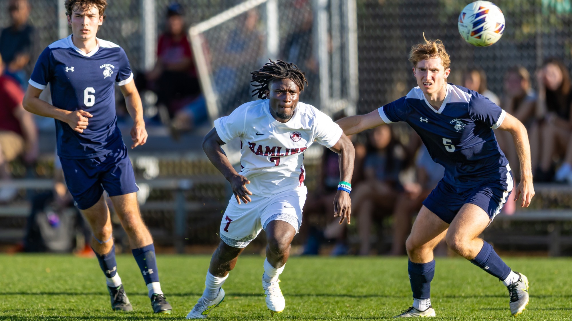 Gus Feika running for the ball against Carleton