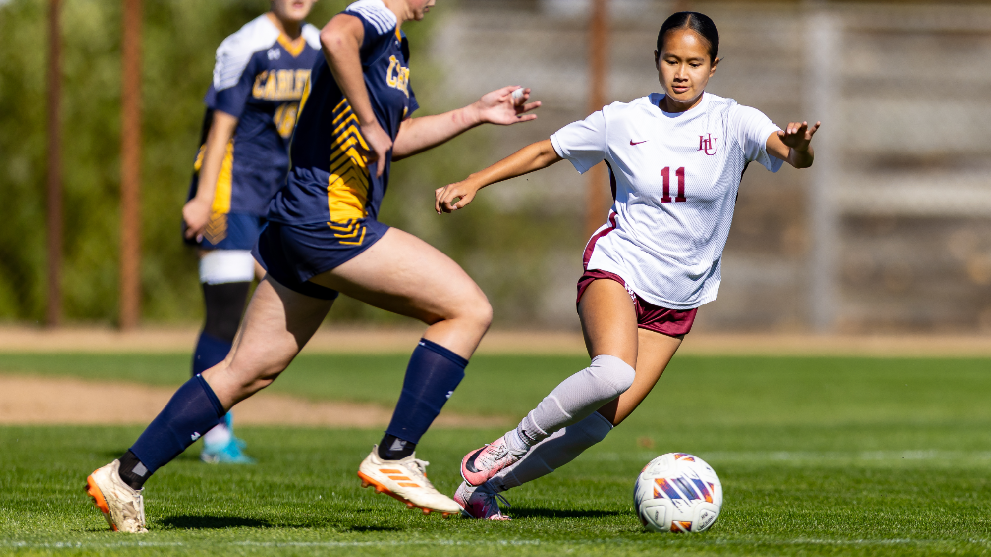 Ellie Nhean going after the ball against Carleton 