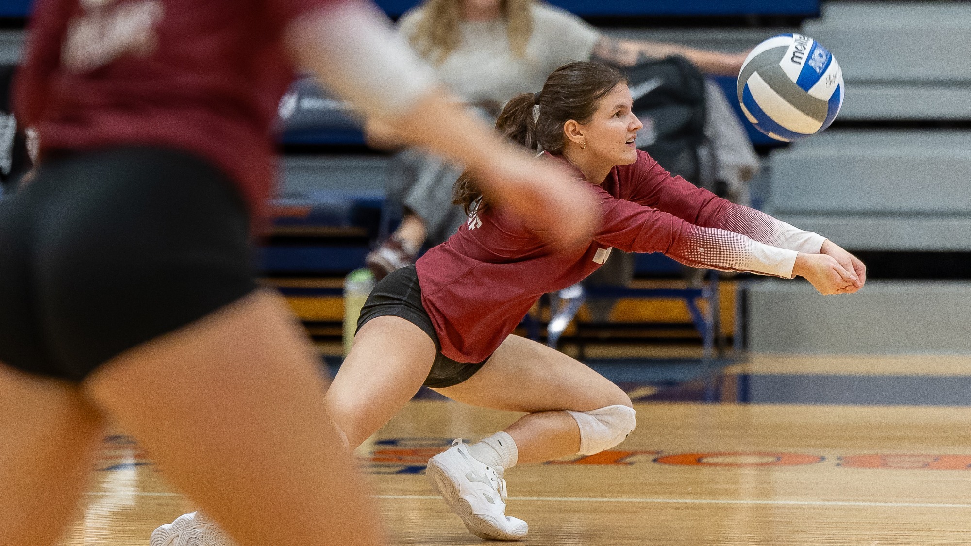 Claire Siems digging the ball against MAC