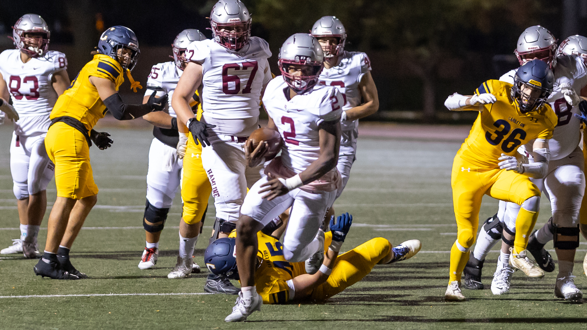 Jah Simmons-Dabney running ball against Carleton